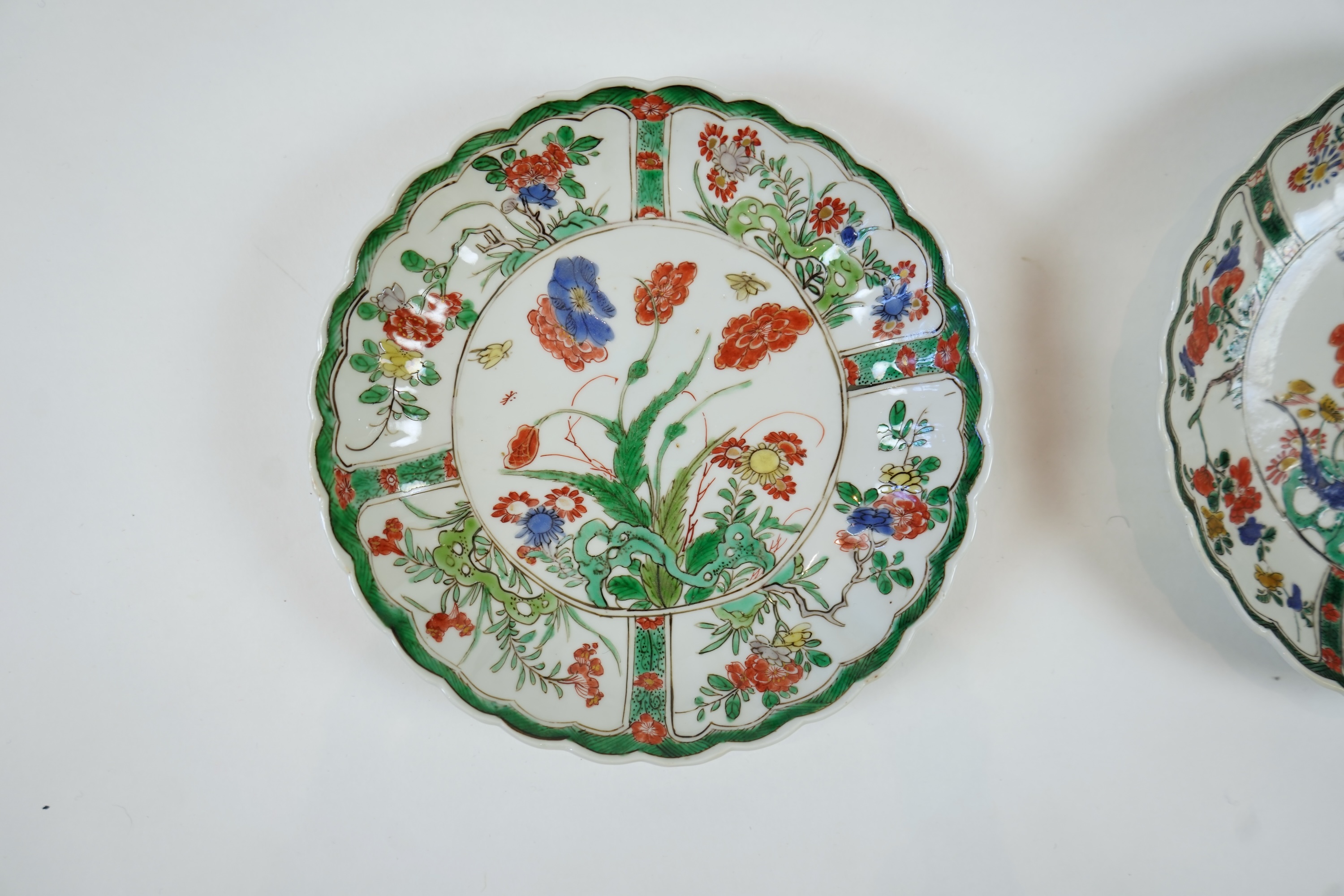 A set of six Chinese famille verte petal lobed saucer dishes, Kangxi period